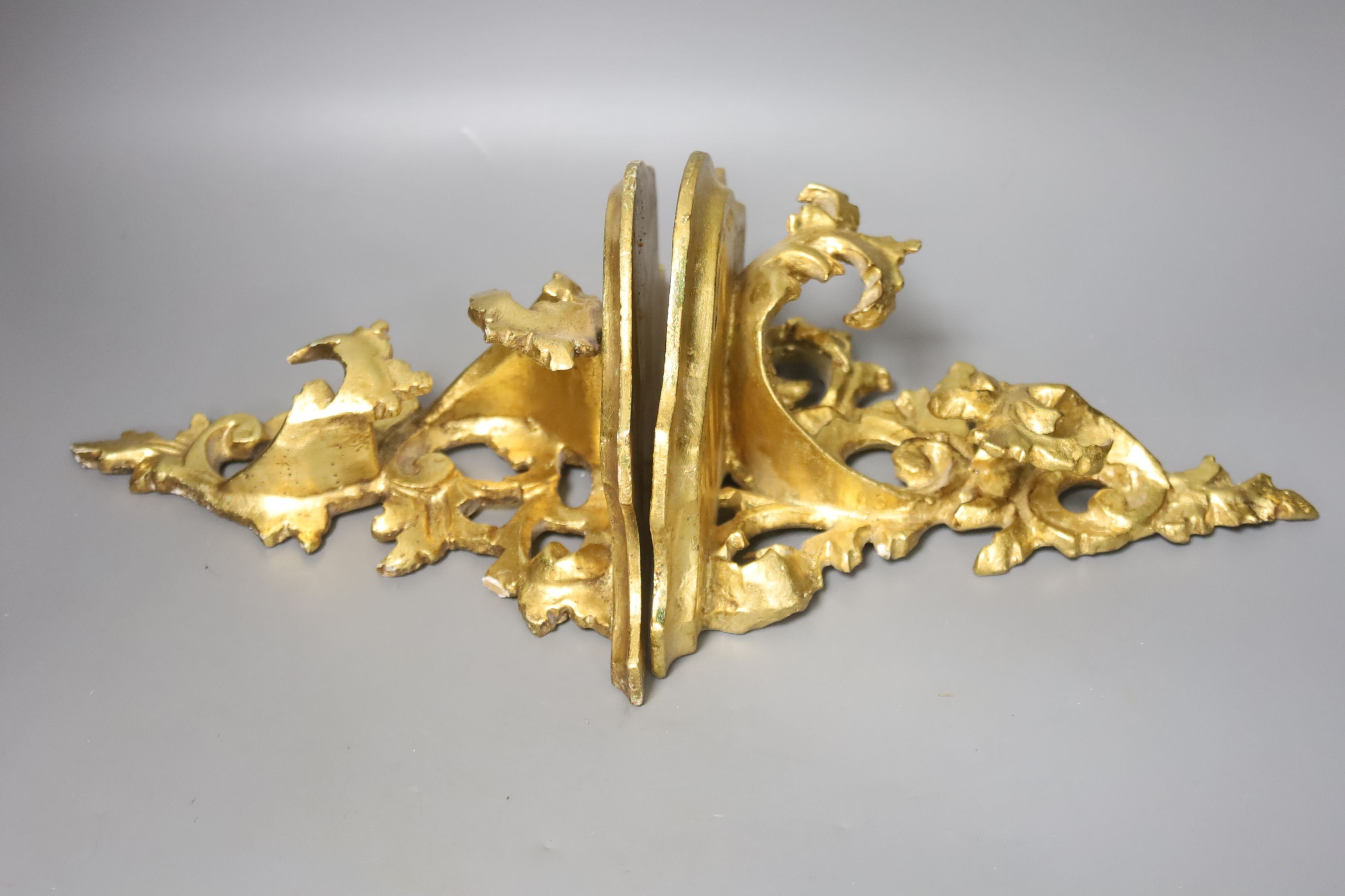 A pair of gilt Florentine style wall brackets